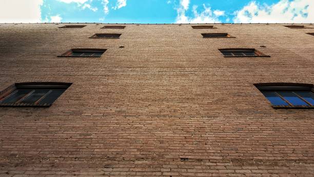 Vertical Brick wall and sky stock photo