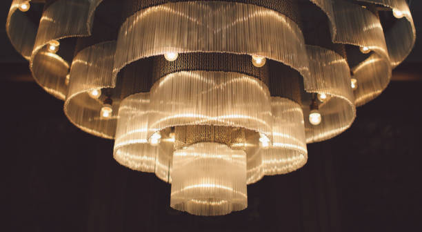 istock Low Angle View Of Illuminated Chandelier Hanging On Ceiling 699158067