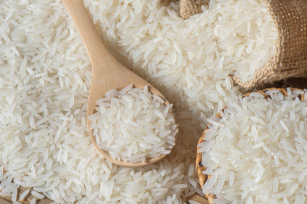 istock Jasmine rice on wooden spoon 699158680