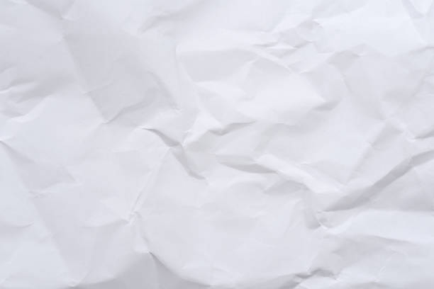 istock White crumpled paper background and texture 699167790