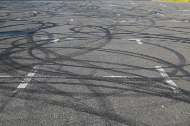 istock High Angle View Of Tire Tracks On Parking Lot 699175659