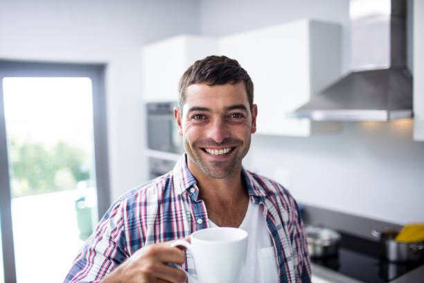 istock Portrait of happy man having coffee 699185964