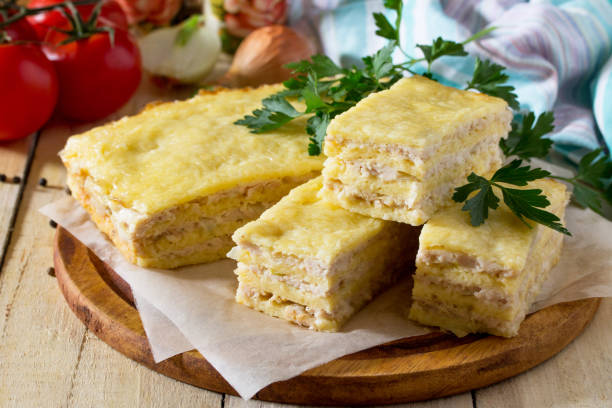 istock Meat casserole from minced meat and cheese on the kitchen table with fresh vegetables. The concept of a healthy diet. 699187726