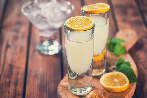 Italian Limoncello , fresh homemade flavorful cocktail combines liqueur,lemon juice,sugar,ice,lemon zest and lemon slices