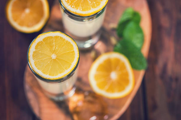 Italian Limoncello , fresh homemade flavorful cocktail combines liqueur,lemon juice,sugar,ice,lemon zest and lemon slices