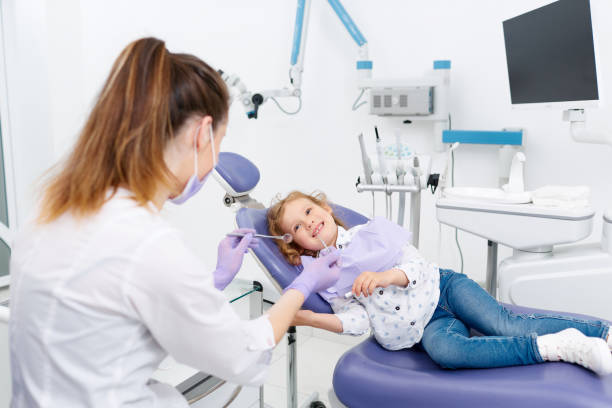istock Smiling little patient at dentist 699195942