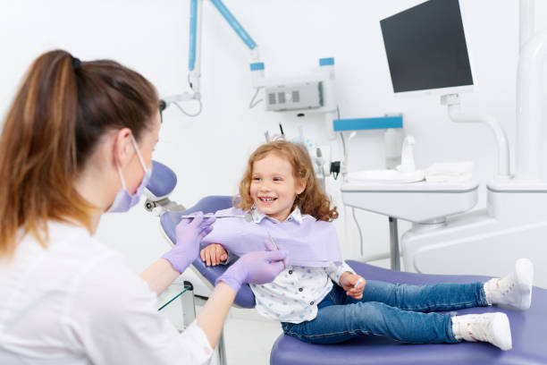 istock Smiling little patient at dentist 699196376