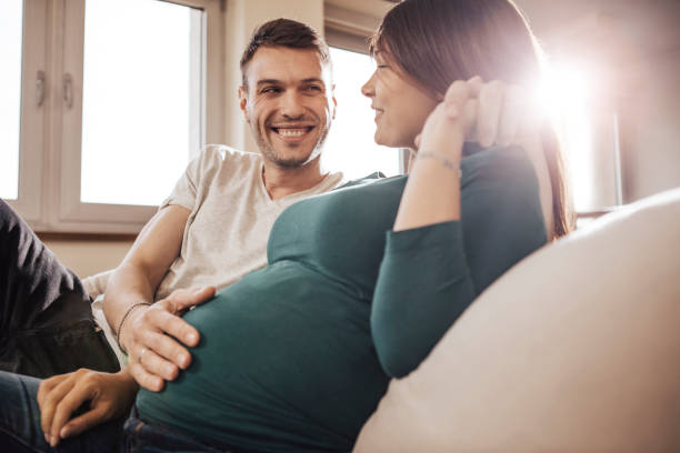 istock Couple sitting on sofa and relaxing 699213024