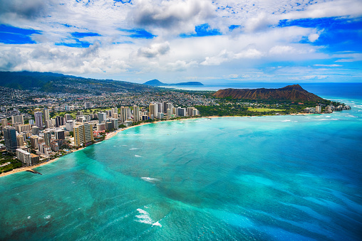The beautiful coastline of the Waikiki area of Honolulu Hawaii shot from an altitude of about 1000 feet during a helicopter photo flight over the Pacific Ocean.