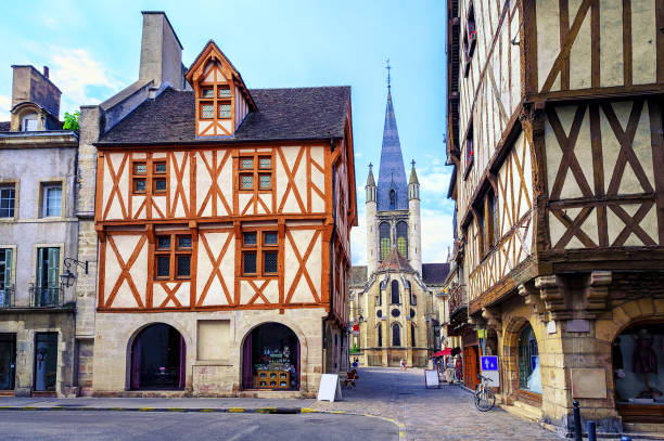 Old town of Dijon, Burgundy, France Tower of the Notre-Dame of Dijon church in the old town of Dijon, Burgundy, France half timbered photos stock pictures, royalty-free photos & images