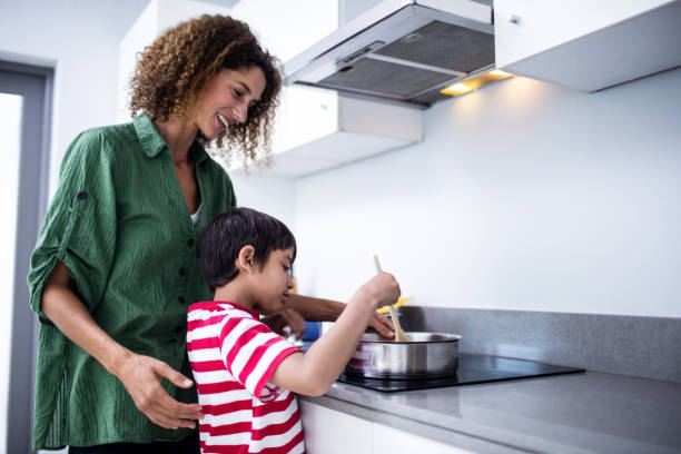 istock Mother and son cooking in kitchen 699230094