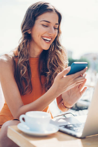 istock Attractive woman texting in cafe 699231322