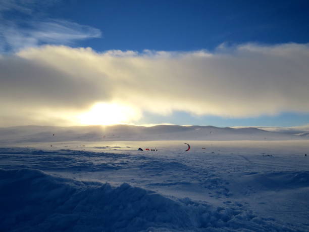 istock Wind surfing and snowkiting in winter 699241386