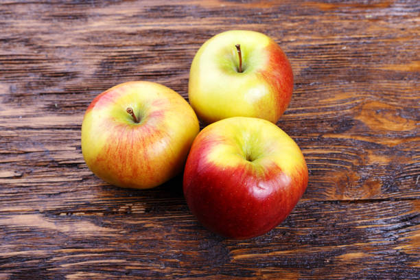 istock ripe apples on a wooden table 699250912