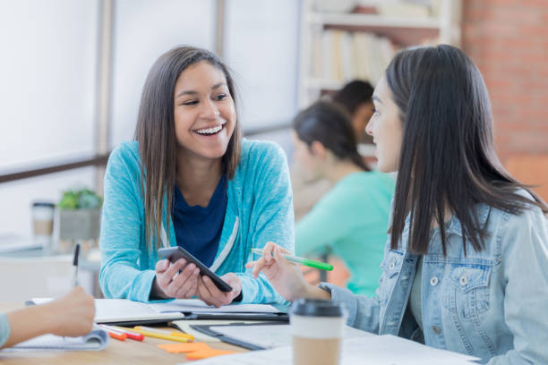 istock Female high school friends enjoy studying together 699251422