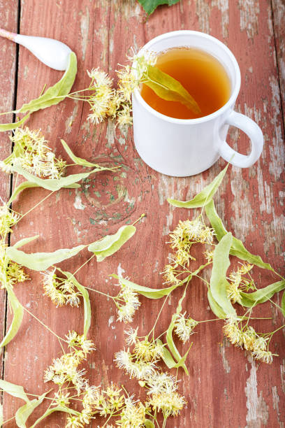 istock tea with a linden on a wooden table 699251524