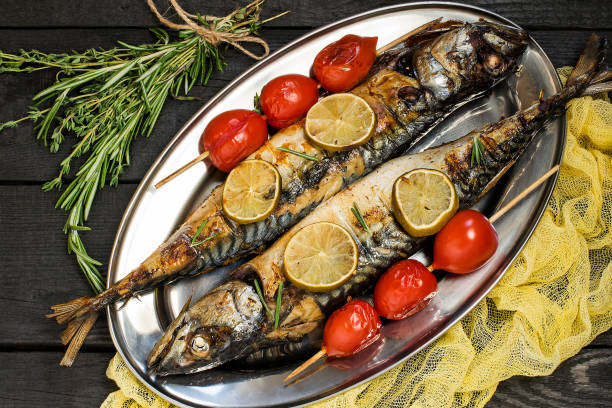 istock Mackerel or scomber cooked on brazier with lime, rosemary, cherry tomatoes 699286230