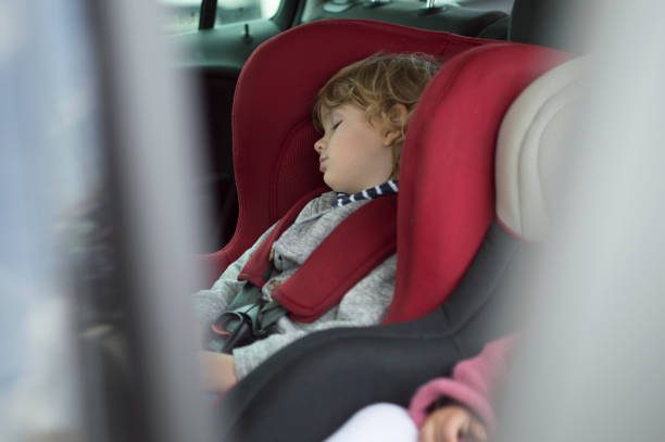 istock Boy in his child safety car seat 699286982
