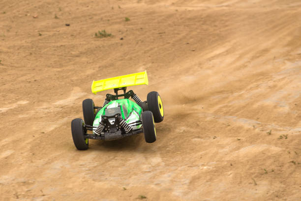 istock Radio controlled car model in race on dirt track 699294412