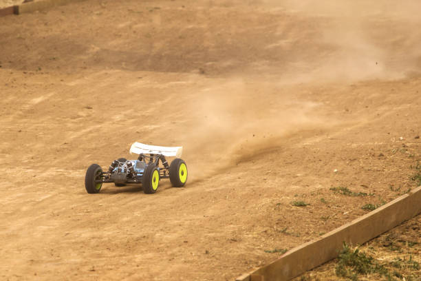 istock Radio controlled car model in race on dirt track 699294858
