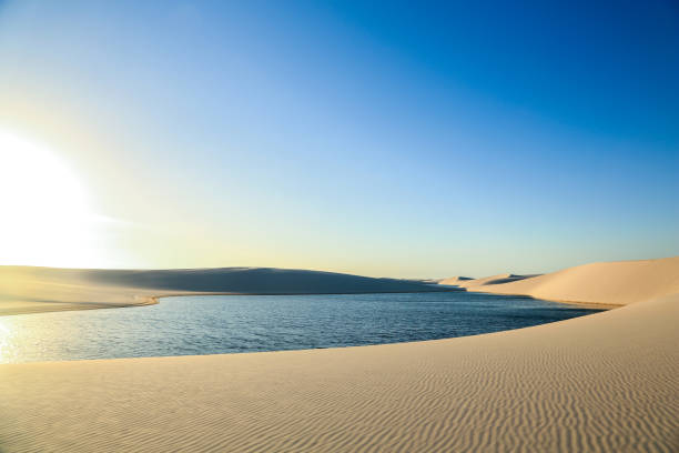Deserted sand dunes of maranhão sheets - big lagoon stock photo