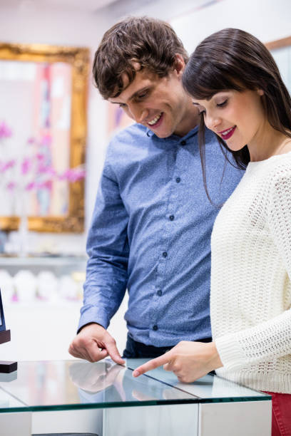 istock Happy couple shopping in mall 699360184