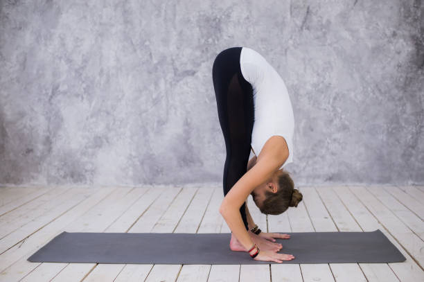 istock Young and fit woman doing exercises at home 699377392