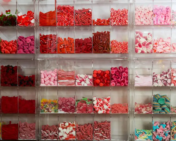 Photo of candys and sweets different colors in supermarket