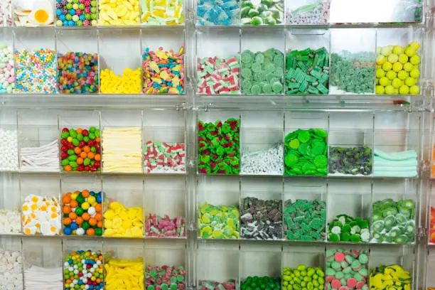 Photo of candys and sweets different colors in supermarket