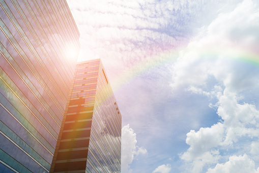 Glass building and blue sky with rainbow