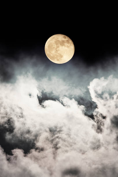 istock night sky with stars, moon and clouds 699544054