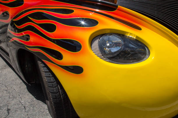 istock Headlight on a car with a flame paint job 699587216