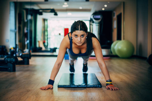 istock Woman at the gym doing exercise 699596748