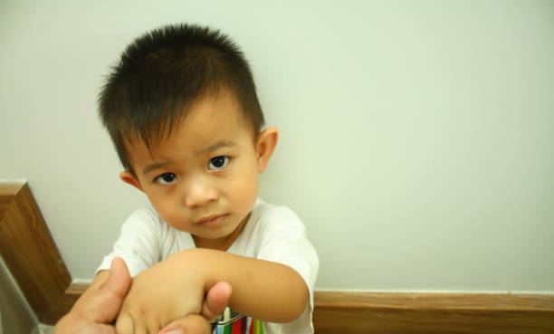 istock Asian boy wearing a white shirt 699618544