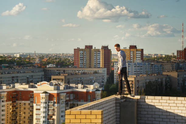 Roofer at edge of roof