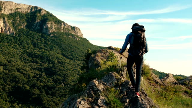 One man, hiking on mountain alone.