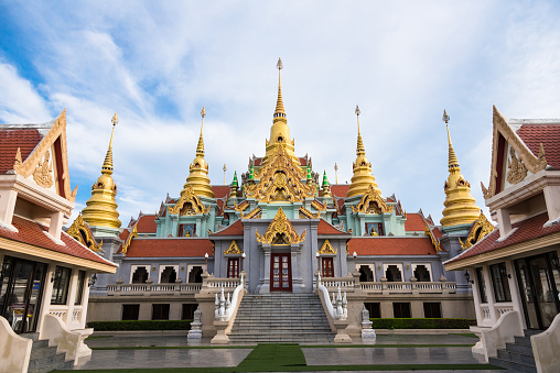 Wat Phra That Luang Golden Pagoda with blue sky at Vien Tiane, Laos.