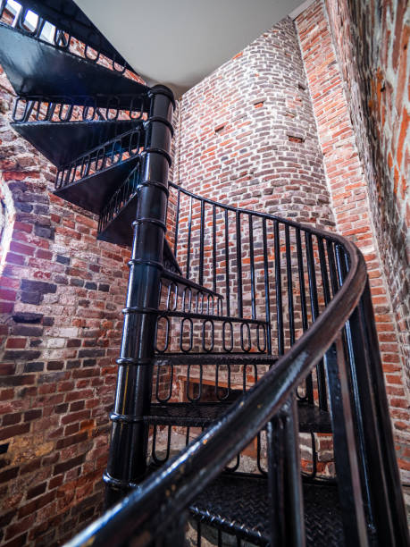 istock Spiral staircase inside of an old lighthouse 699702112