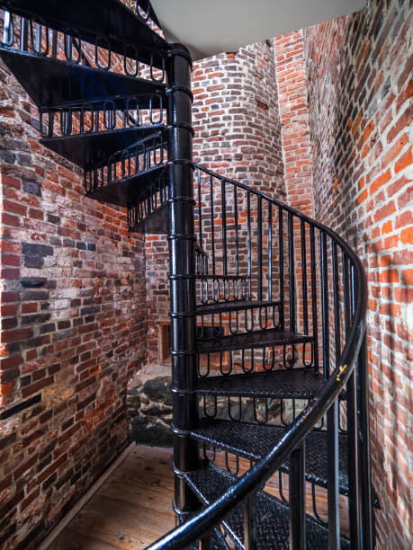 istock Spiral staircase inside of an old lighthouse 699702114