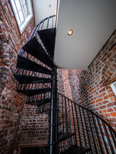 istock Spiral staircase inside of an old lighthouse 699702116
