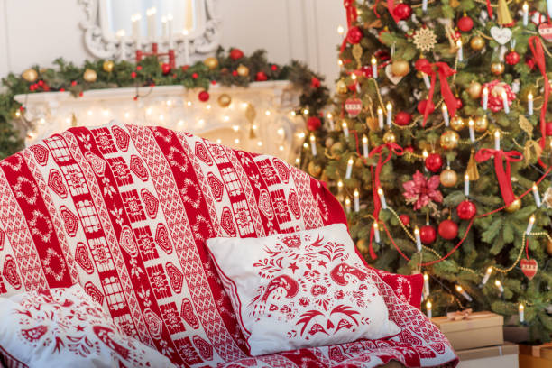 istock Christmas Tree and Christmas gift boxes in the interior with a fireplace. 699725690