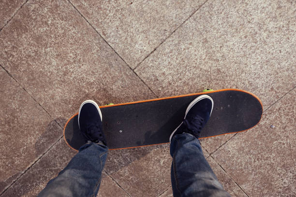 istock young skateboarder legs riding on skateboard 699726330