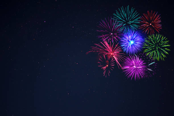istock Pink purpe blue green fireworks copy space. 699733916