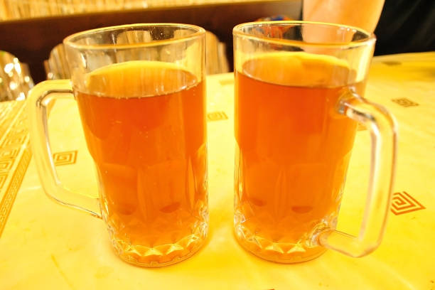 istock Two mugs of kvass on the table 699759492