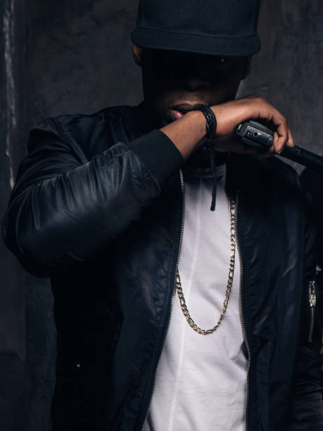 istock Unrecognizable black criminal with gun closeup 699782606