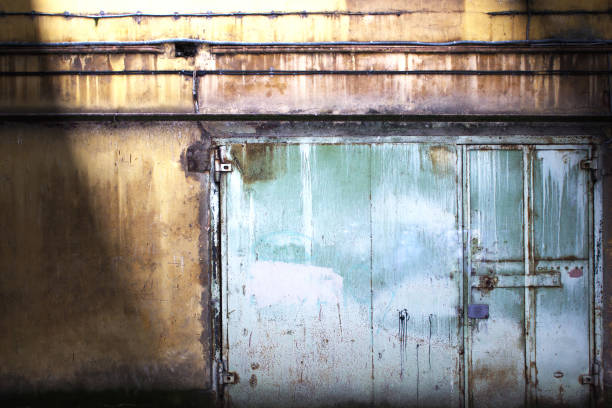 istock metal gate covered with shabby paint, grunge background 699782960