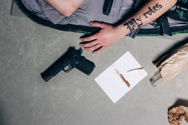 istock Gangster lifestyle. Gun, cigarette, alcohol 699783440