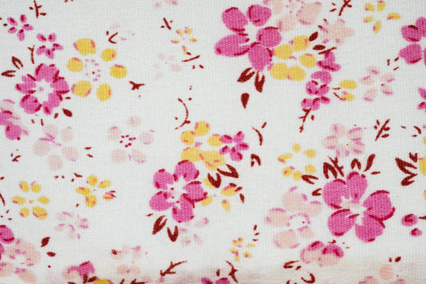 istock White cloth texture background with pink flowers striped 699788732