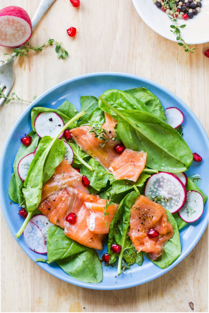 istock Salmon with spinach and pomegranate  salad by sea salt 699798964