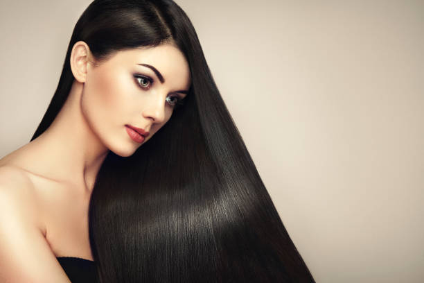 istock Beautiful woman with long smooth hair 699802722